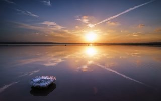 Beautiful salt lake landscape, Golden sunset and reflections over de salt marsh, Las salinas, Torrevieja, Spain, Parque Natural de las Lagunas de La Mata y Torrevieja.
